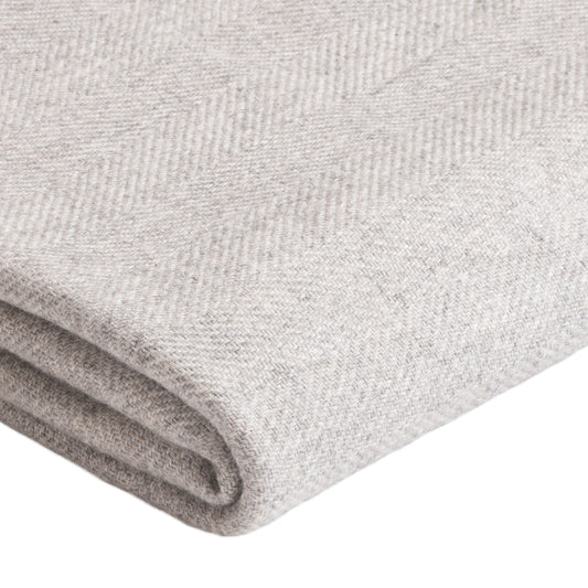 Custom cashmere blanket inspired by Himalayan heritage, crafted with traditional craftsmanship and modern luxury
