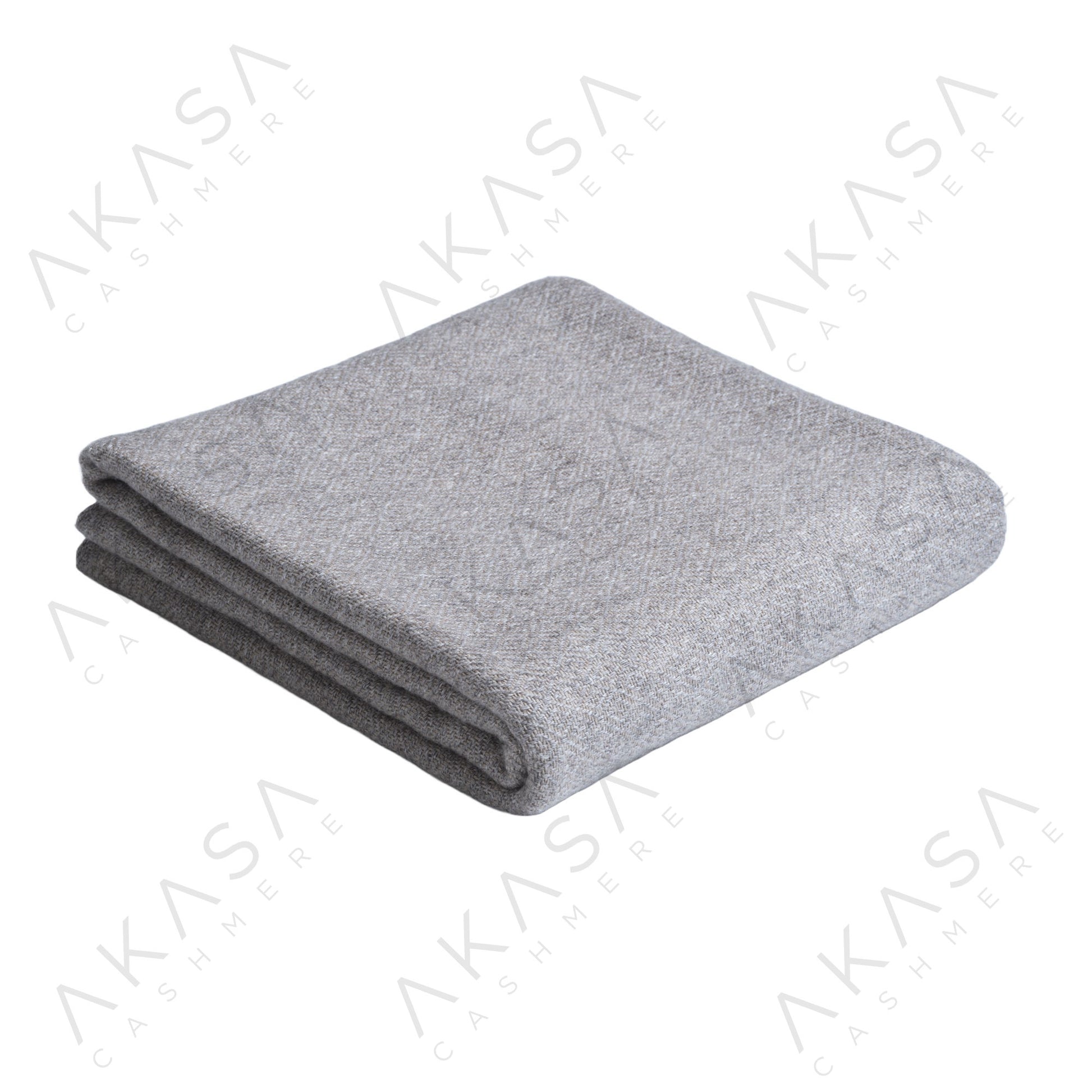 Custom cashmere blanket inspired by Himalayan heritage, crafted with traditional craftsmanship and modern luxury