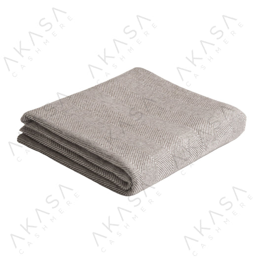 Custom cashmere blanket inspired by Himalayan heritage, crafted with traditional craftsmanship and modern luxury